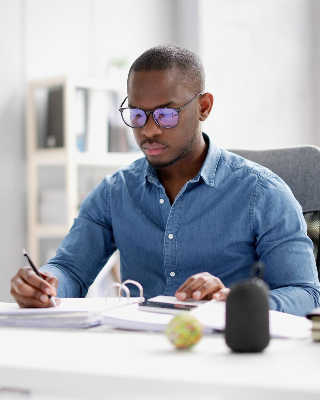 Business owner reviewing compliance documents at a desk